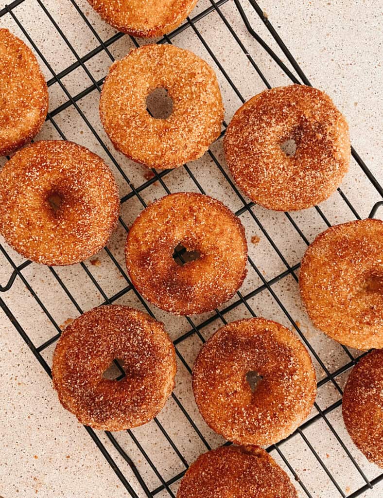 apple cider donuts on a wire rack 
