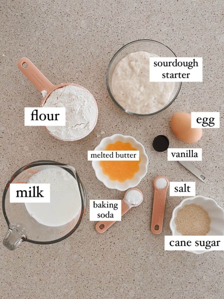 fluffy sourdough pancakes ingredients laid out on a counter 