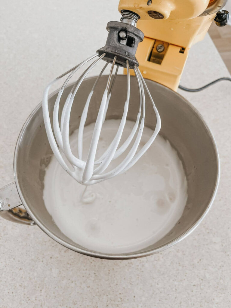 marshmallows formed in yellow kitchen aid mixer with whisk attachment 