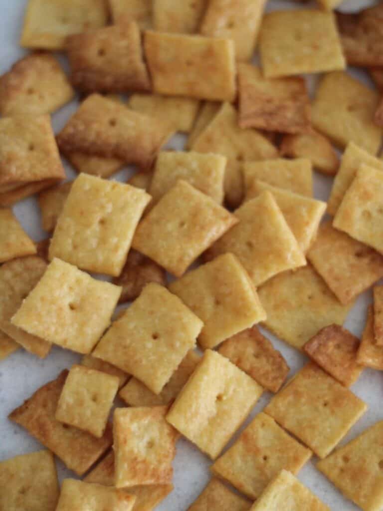 Cheese crackers on parchment paper ready to eat. 