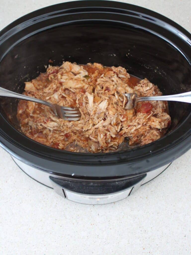 Salsa Chicken cooked and shredded in the crockpot.